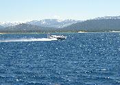 Fire tanker plane picking up water